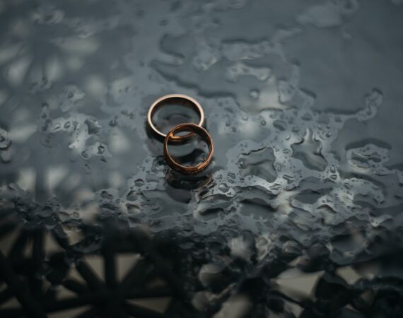 two wedding rings on table